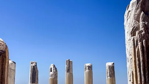 Ancient stone columns standing in the ruins of an old temple.