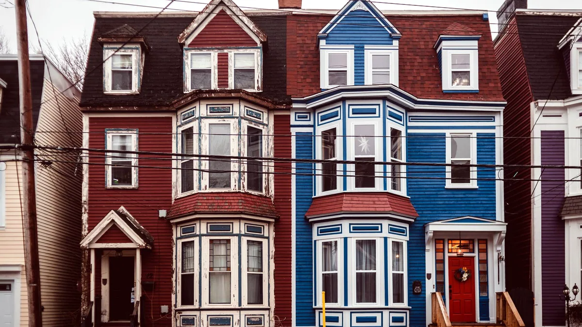 A row of houses each in a different architectural style.