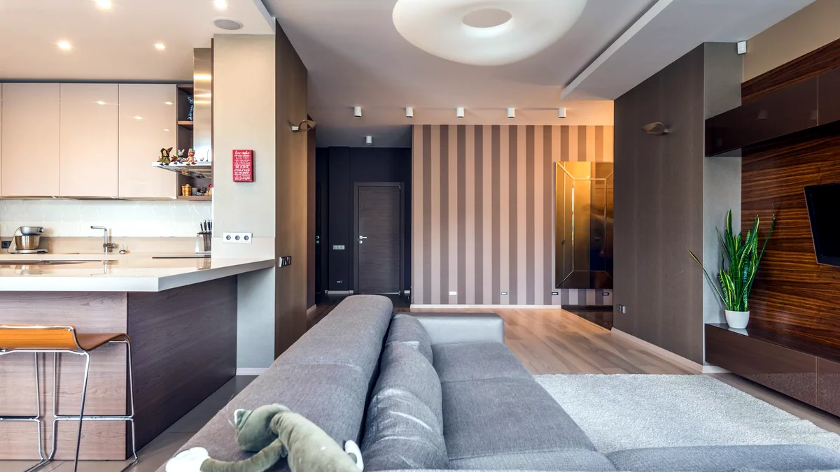 A bright living room interior with warm wood and soft light.